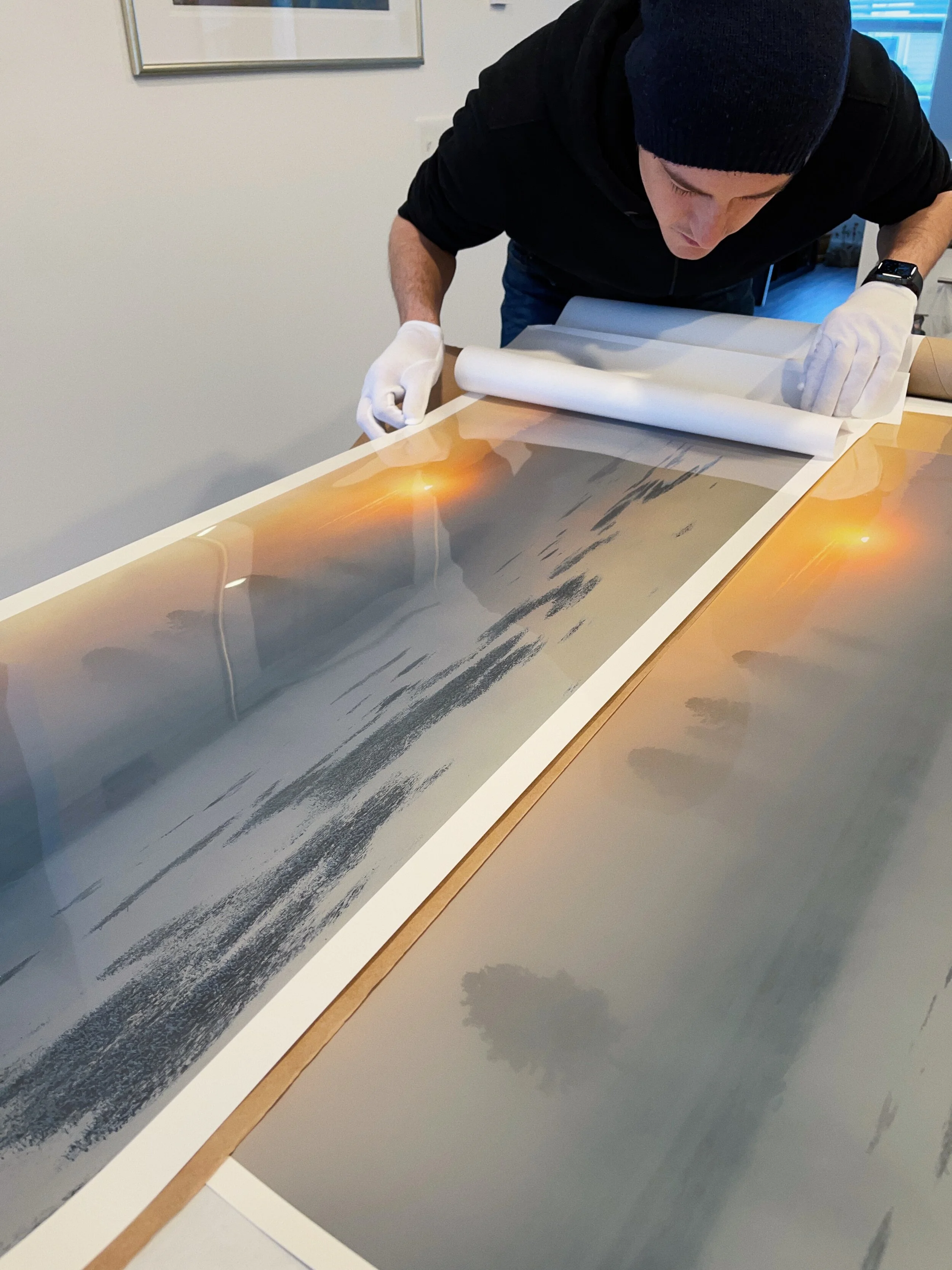 Inspecting photographs made in a darkroom on a LightJet machine and Fuji Flex material.